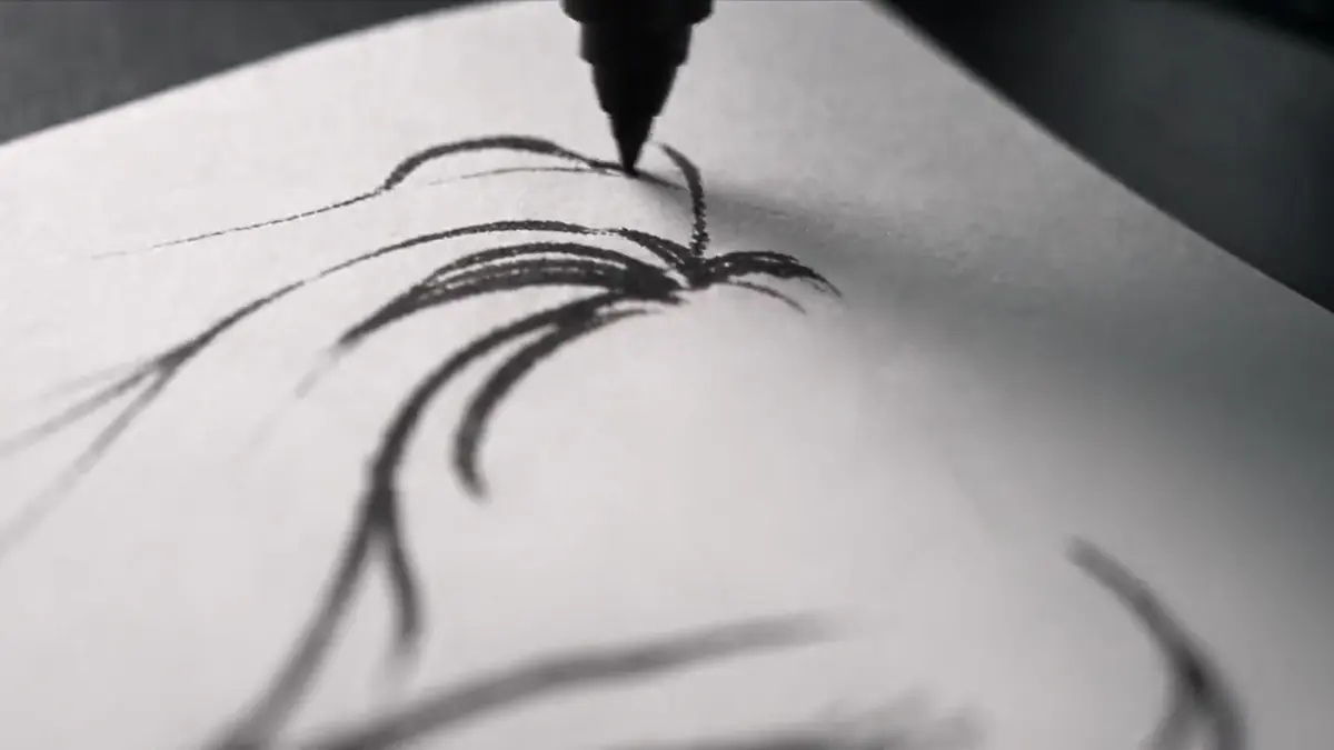 The PictiaX® pen drawing a caricature on paper